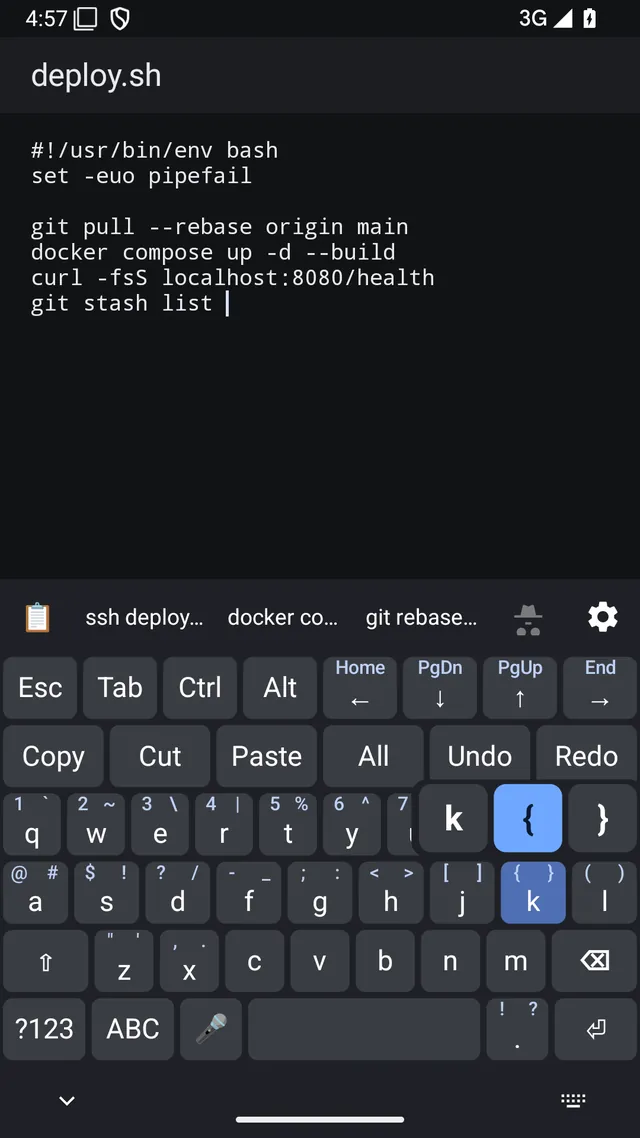 Code mode with the press-and-hold popup open on the K key, showing the opening and closing brace